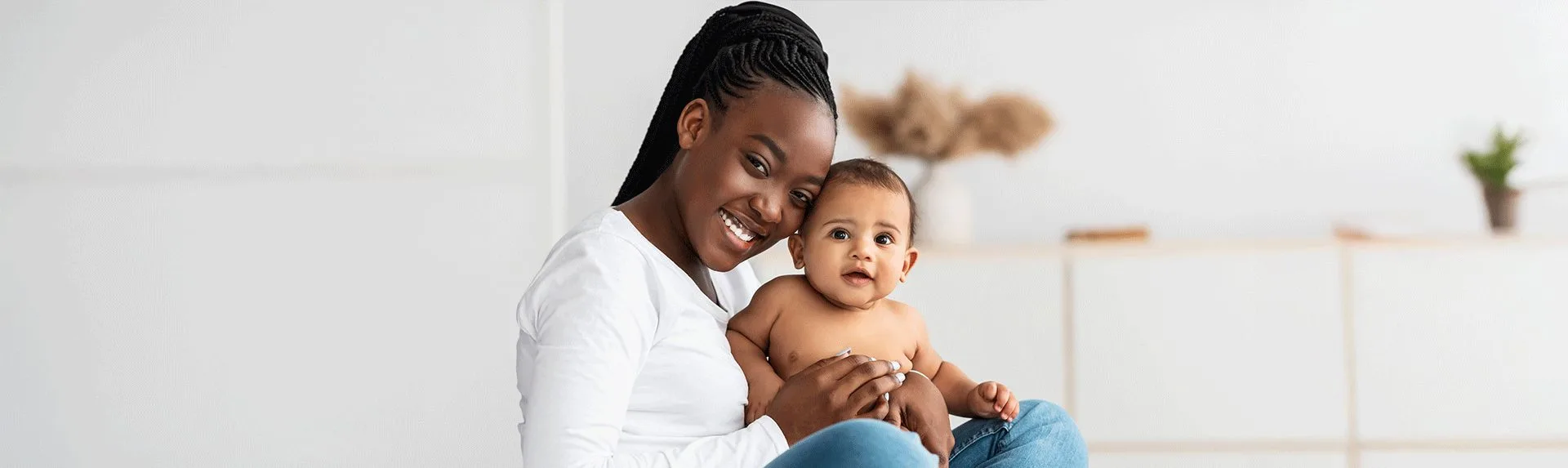 smiling mom holding her baby boy